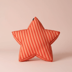 Large star-shaped floor cushion called the Superstar Crash Pad, featuring red and orange stripes on a light pink background.